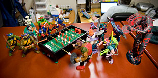 Teenage Mutant Ninja Turtles playing foosball