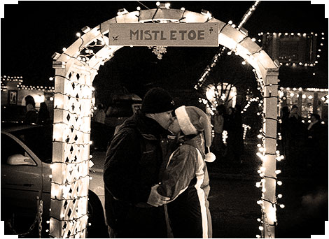 Kissing under a mistletoe at Peacock Lane